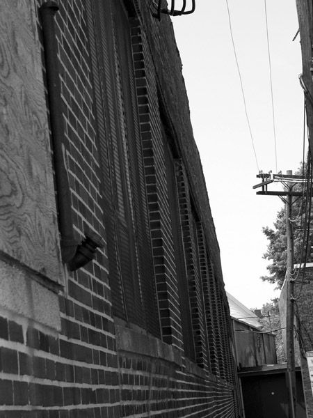 Narrow alley, brick windows.