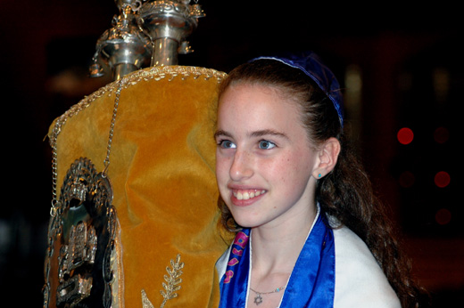 Becca carrying the Torah.